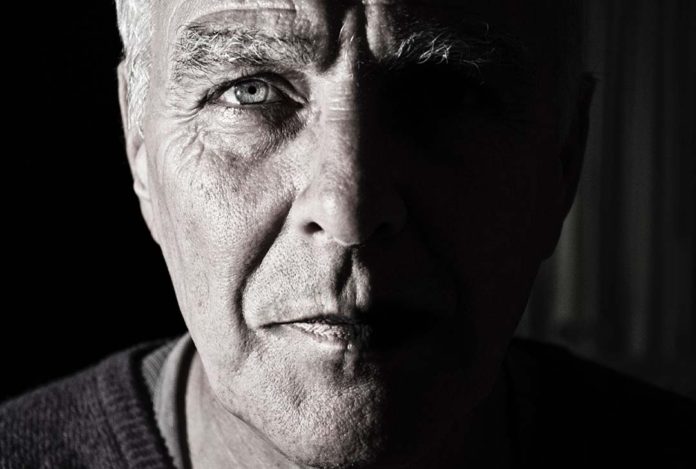 Elderly man's face in black and white